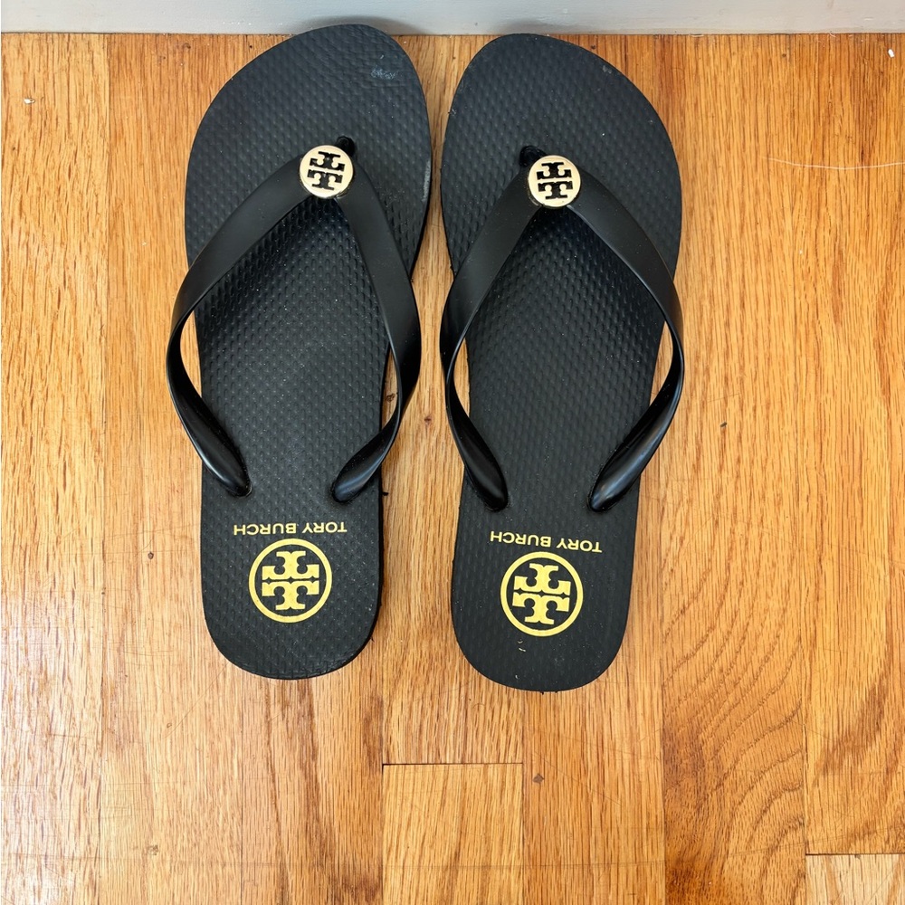 Tory Burch Black and Gold Flip Flops